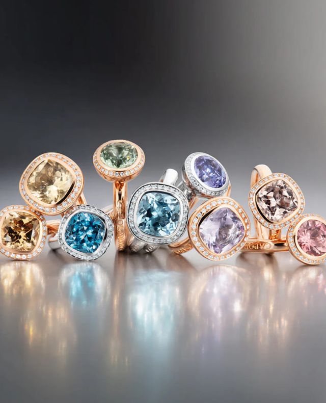 Capolavoro Twinkle Balloon Ringe in Rose- und Weissgold mit Diamanten und verschiedenen Farbedelsteinen auf grauem Hintergrund
