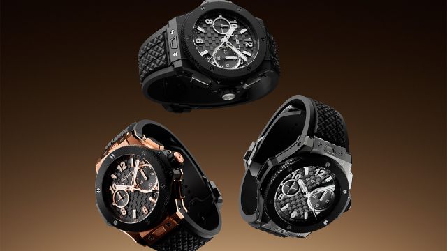 Mehrere Hublot Big Bang Chronographen mit schwarzem Zifferblatt und Kautschukarmband, verschiedene Gehäusematerialien in dynamischer Schrägansicht