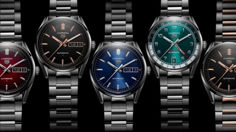 Mehrere TAG Heuer Day-Date Uhren nebeneinander liegend vor schwarzem Hintergrund Mehrere TAG Heuer Day-Date Uhren nebeneinander liegend vor schwarzem Hintergrund